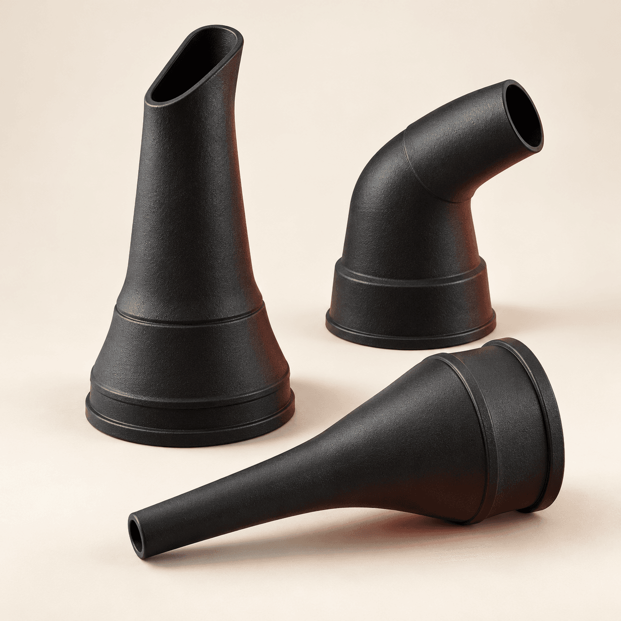Illustrative studio arrangement of black molded rubber nozzle forms